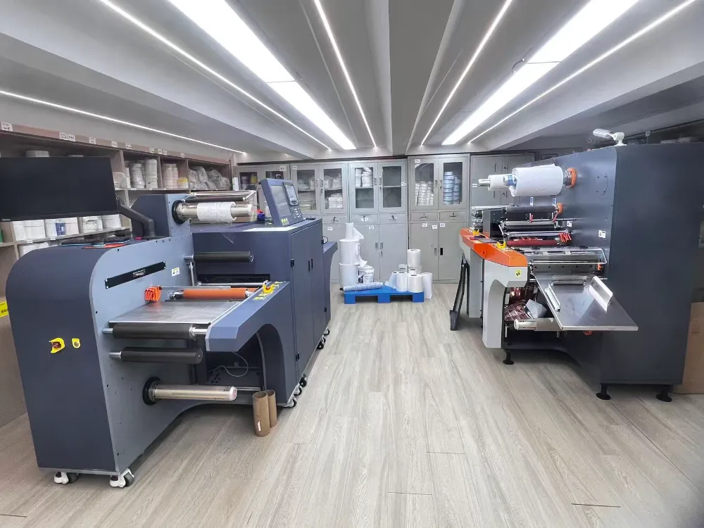 Xinsen Packaging cleanroom workshop showing finished rolls of custom Waterproof Electronic Product Sticker Labels